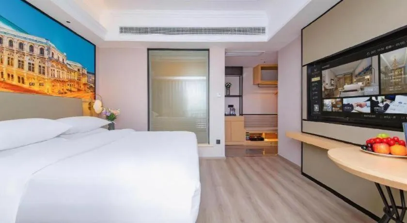 Bed in Vienna International Hotel Wuhan Huanghelou Pengliuyang Metro Station