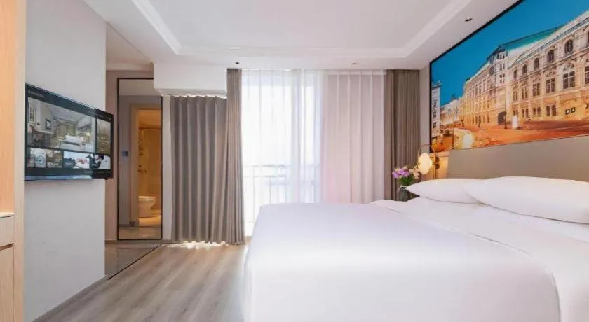 Bed in Vienna International Hotel Wuhan Huanghelou Pengliuyang Metro Station