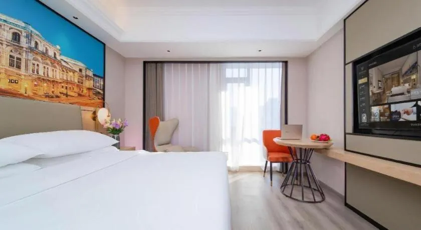 Bed in Vienna International Hotel Wuhan Huanghelou Pengliuyang Metro Station