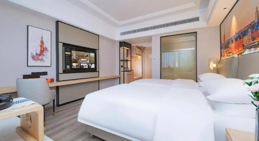 Bed in Vienna International Hotel Wuhan Huanghelou Pengliuyang Metro Station