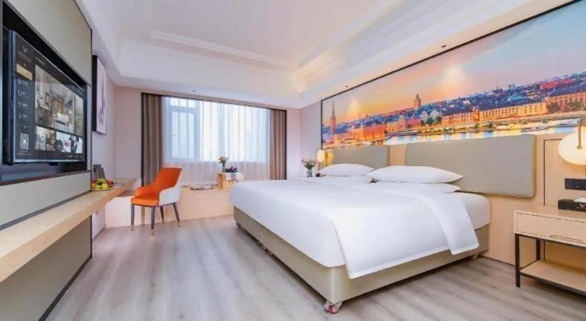 Bed in Vienna International Hotel Wuhan Huanghelou Pengliuyang Metro Station