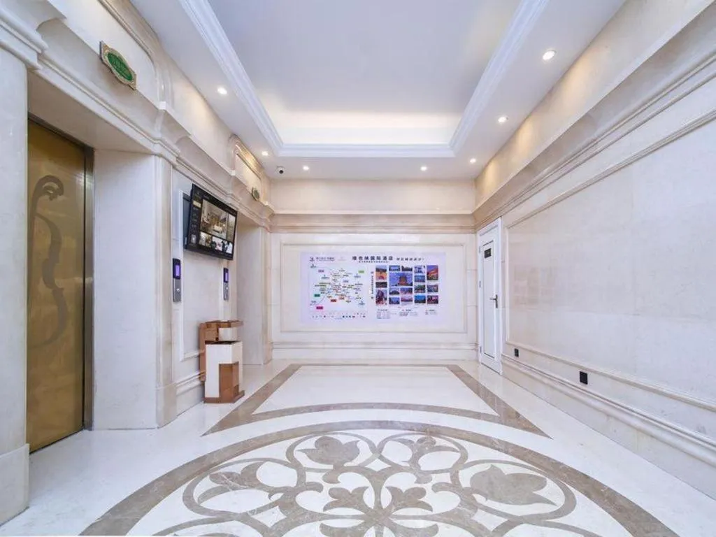 Bed in Vienna International Hotel Wuhan Huanghelou Pengliuyang Metro Station