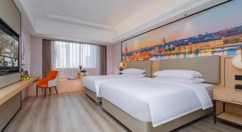 Bed in Vienna International Hotel Wuhan Huanghelou Pengliuyang Metro Station