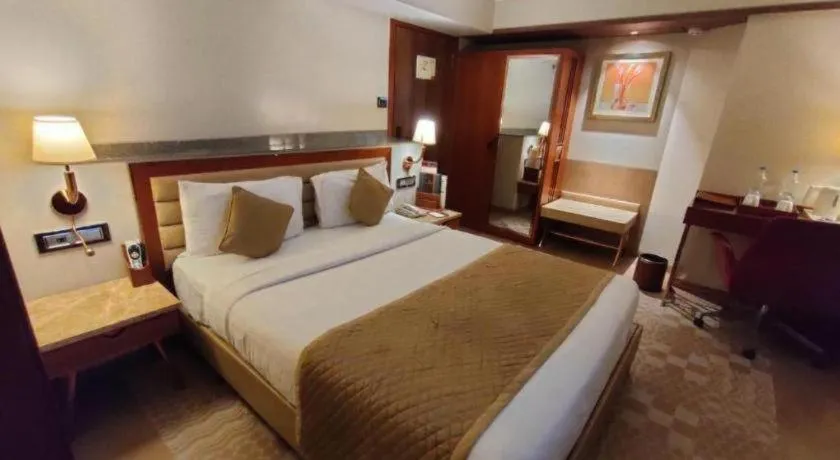 Bed in The Grandeur Boutique Hotel