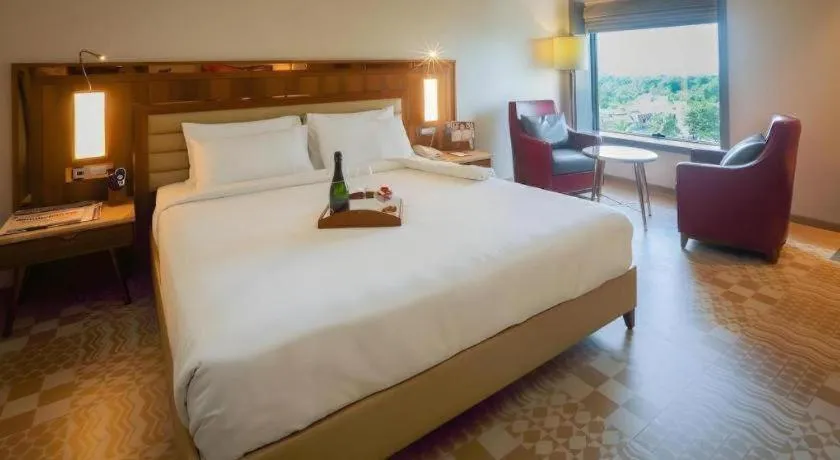 Bed in The Grandeur Boutique Hotel