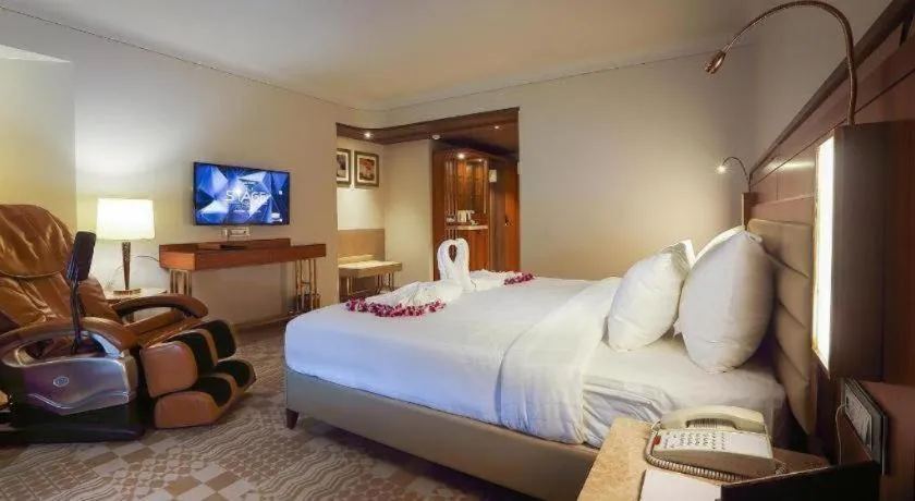 Bed in The Grandeur Boutique Hotel