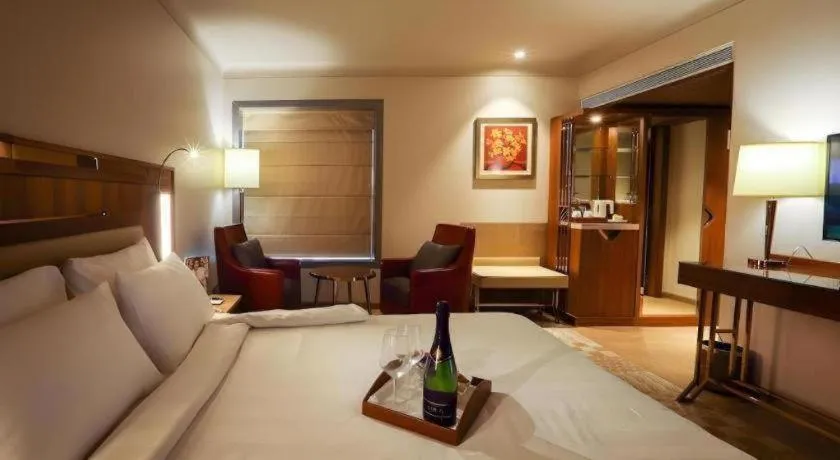 Bed in The Grandeur Boutique Hotel