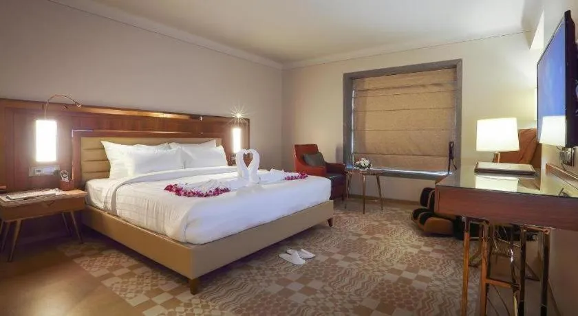 Bed in The Grandeur Boutique Hotel