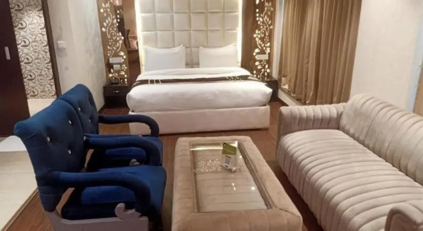 Bed in Hotel Signature Grand