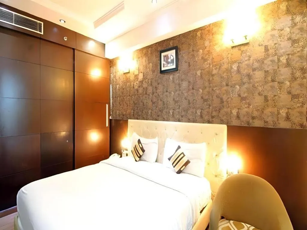 Bed in Hotel Signature Grand