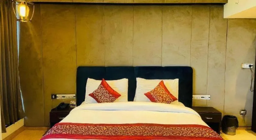 Bed in Hotel Signature Grand