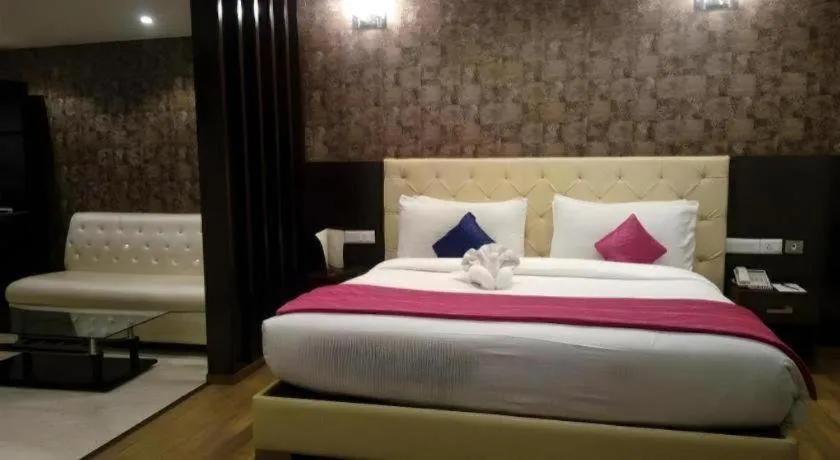 Bed in Hotel Signature Grand