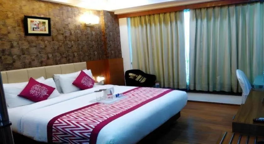 Bed in Hotel Signature Grand