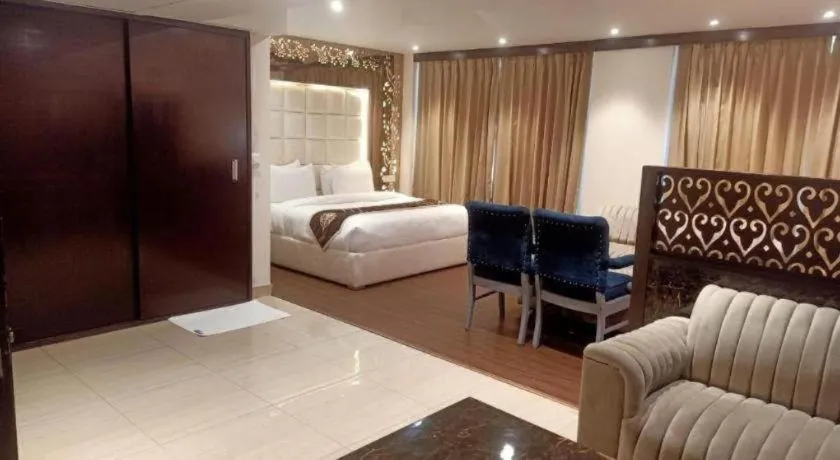 Bed in Hotel Signature Grand