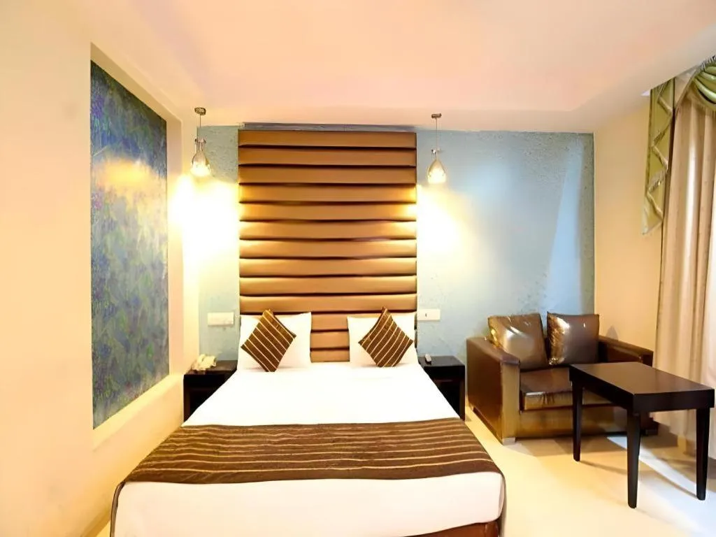 Bed in Hotel Signature Grand