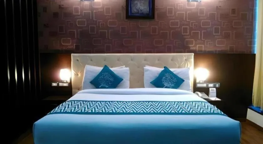 Bed in Hotel Signature Grand