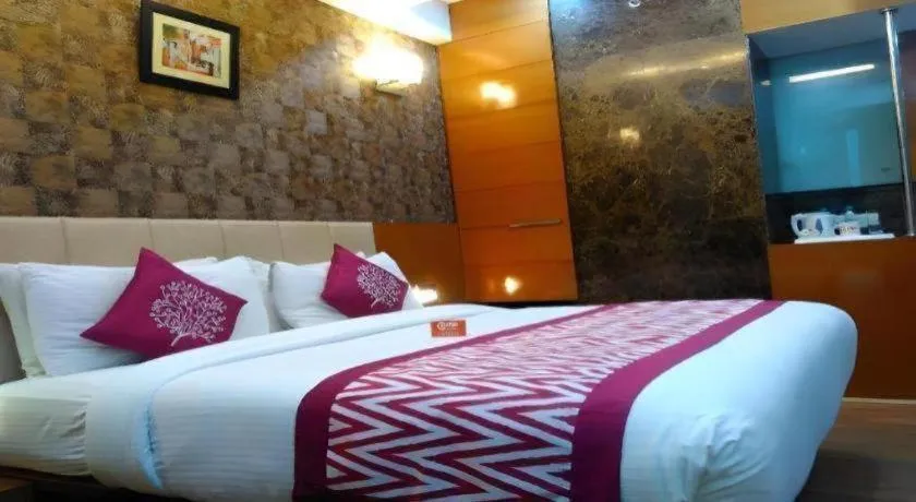 Bed in Hotel Signature Grand