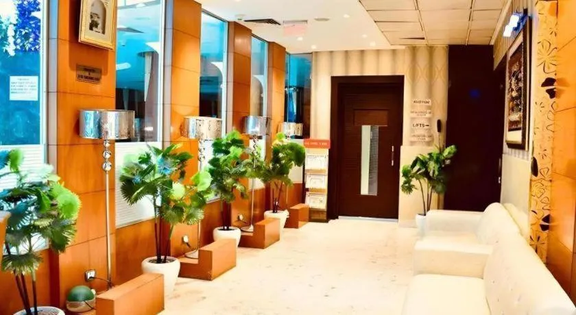 Bed in Hotel Signature Grand