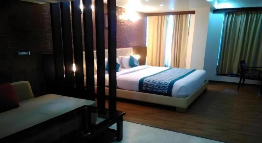 Bed in Hotel Signature Grand