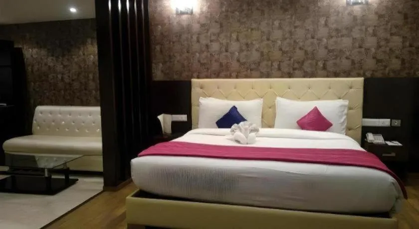 Bed in Hotel Signature Grand