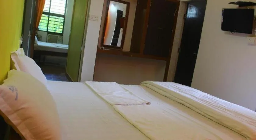 Bed in Poonam Village Resort