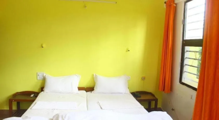 Bed in Poonam Village Resort