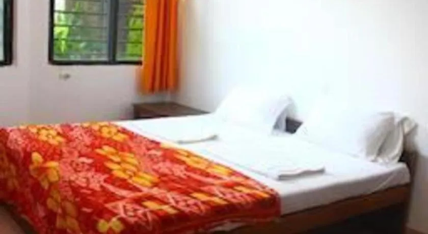 Bed in Poonam Village Resort