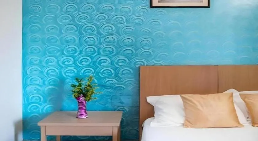 Bed in Palm Air by Goa Signature Stays