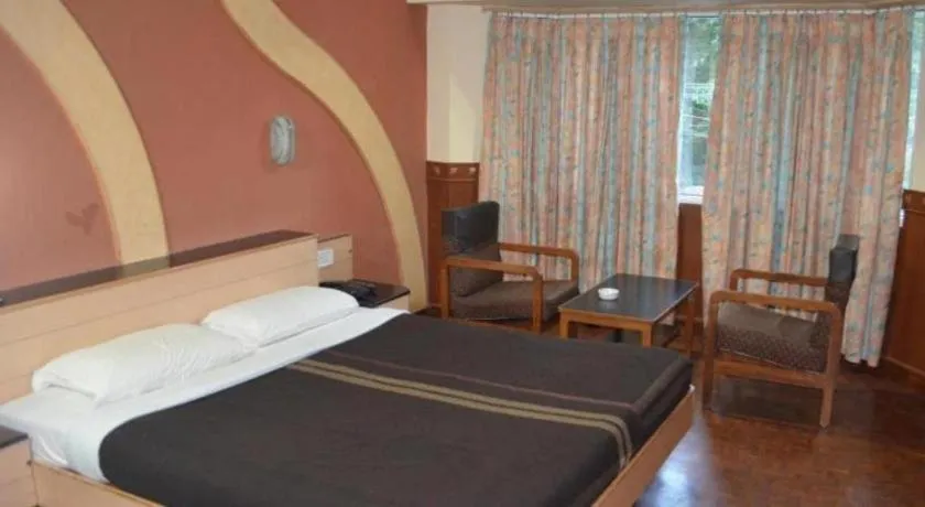 Bed in Hotel Hilltop Towers