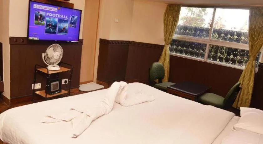 Bed in Hotel Hilltop Towers