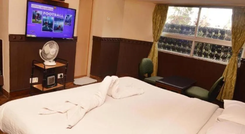 Bed in Hotel Hilltop Towers