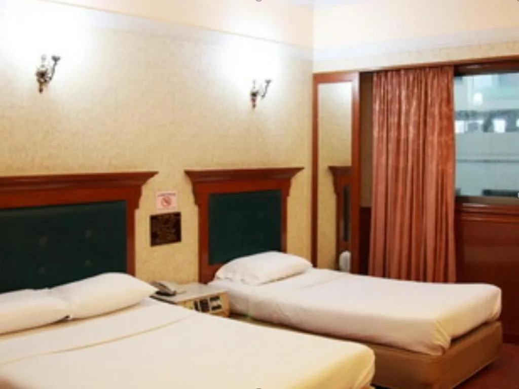 Bed in Pradipat Hotel