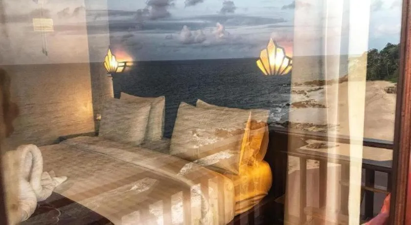 Bed in Diamond Cliff Beach Lanta Resort