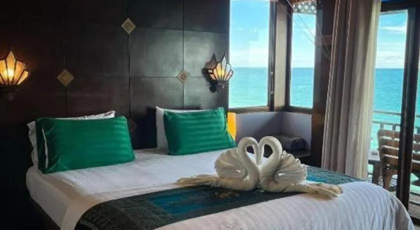 Bed in Diamond Cliff Beach Lanta Resort