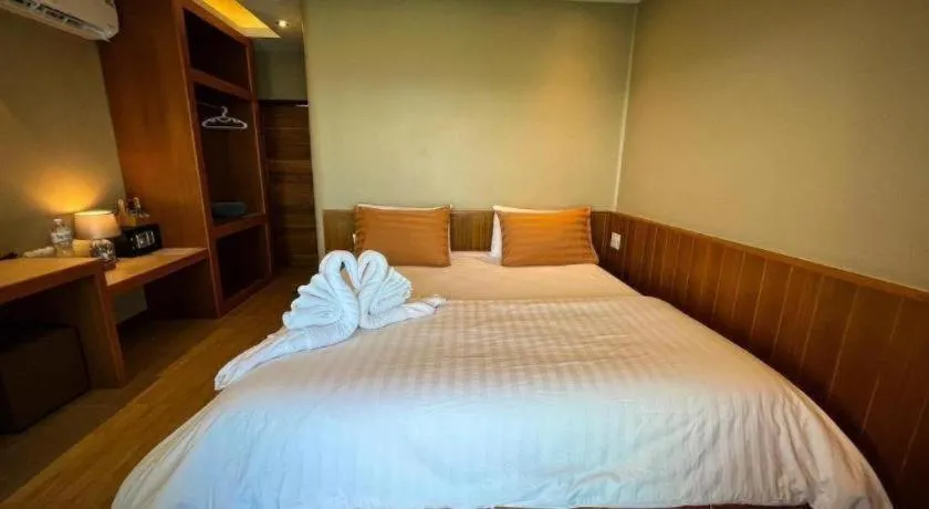 Bed in Diamond Cliff Beach Lanta Resort