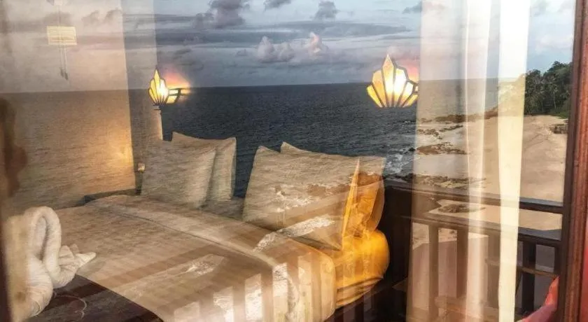 Bed in Diamond Cliff Beach Lanta Resort