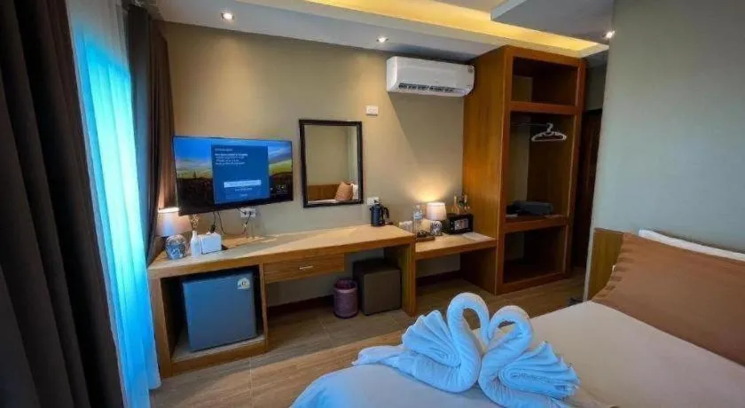 Bed in Diamond Cliff Beach Lanta Resort