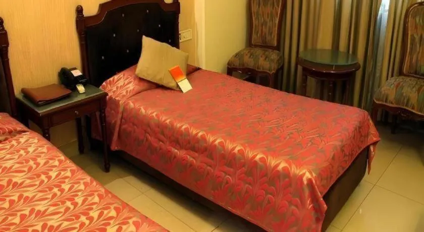 Bed in Hotel Grand President