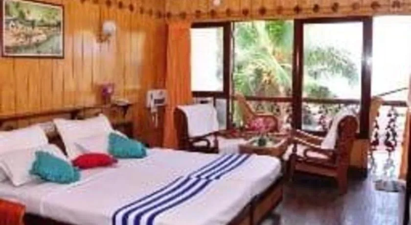 Bed in Jeevan Ayurvedic Beach Resort