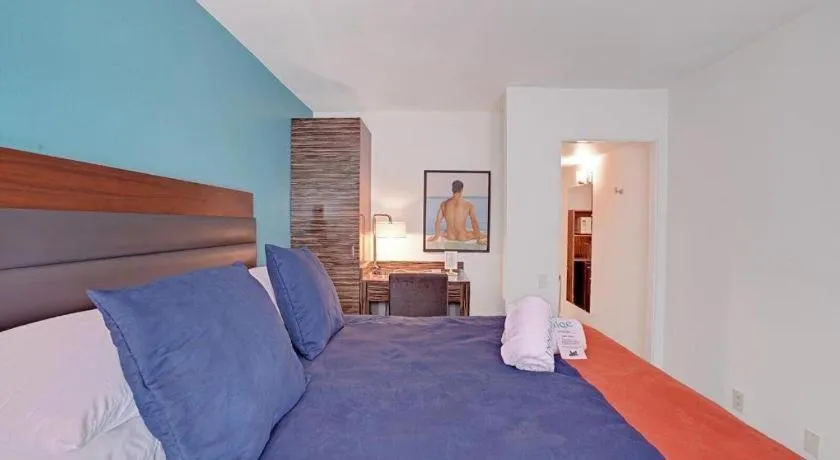 Bed in INNdulge Iconic Gay Men's Resort