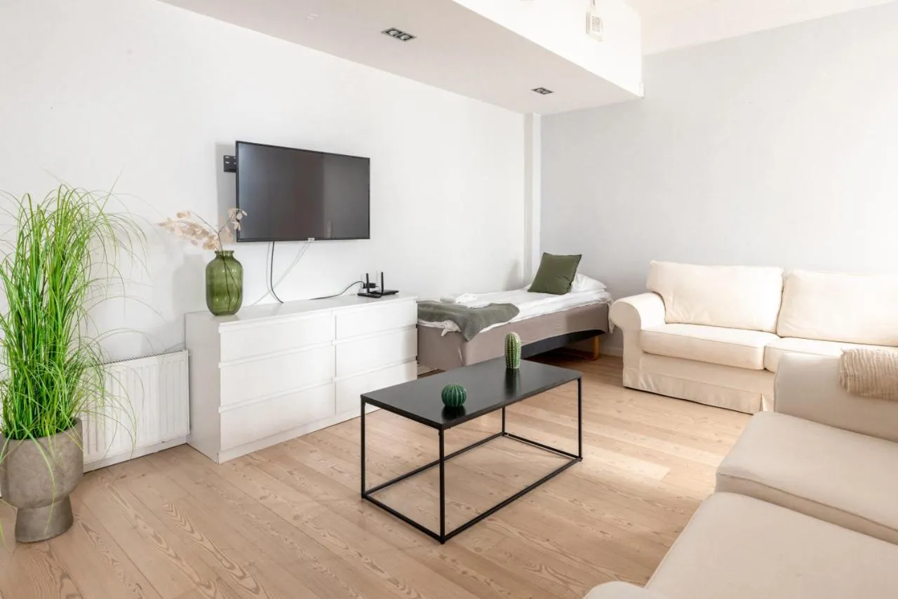 TV and multimedia in 2ndhomes Loft Apartment with Spa & Balcony by the White Church