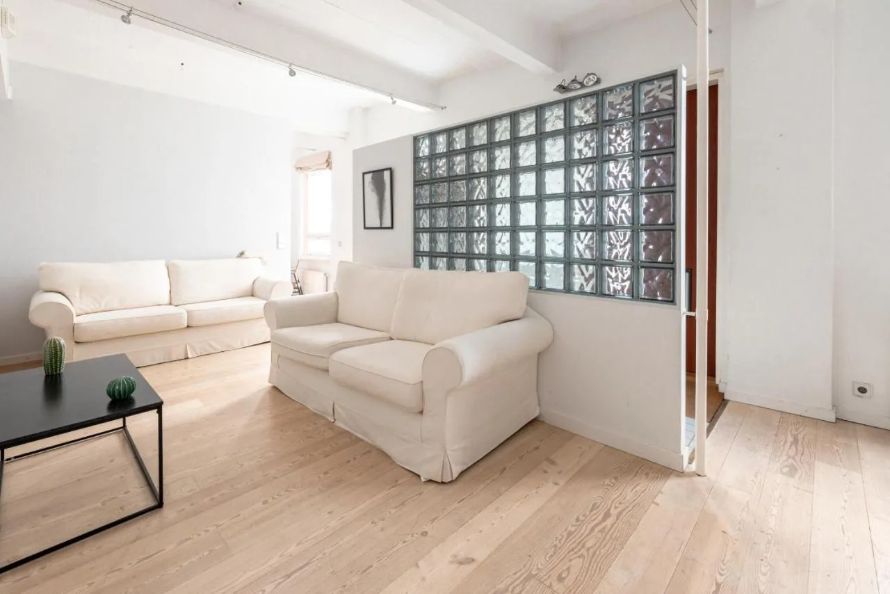 Living room in 2ndhomes Loft Apartment with Spa & Balcony by the White Church