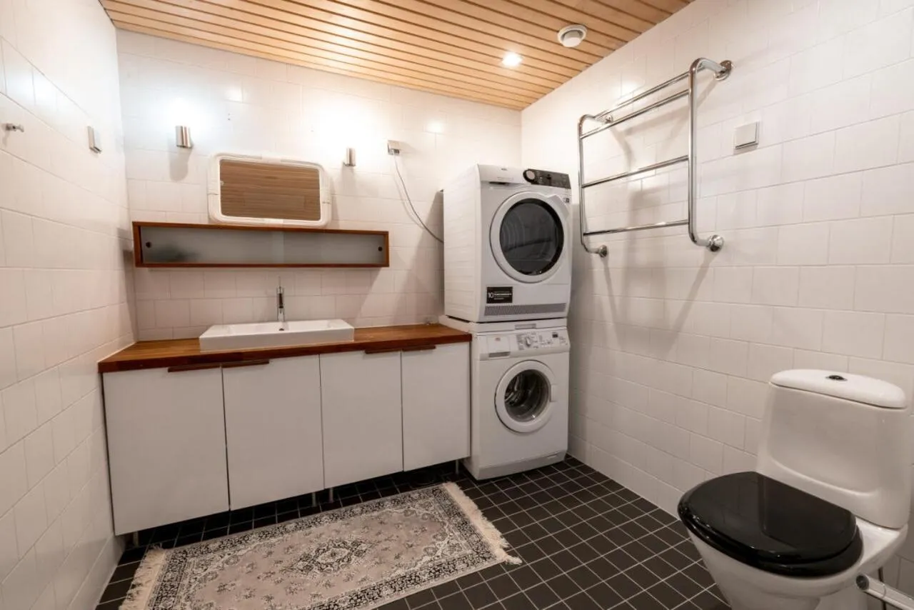 washing machine in 2ndhomes Loft Apartment with Spa & Balcony by the White Church