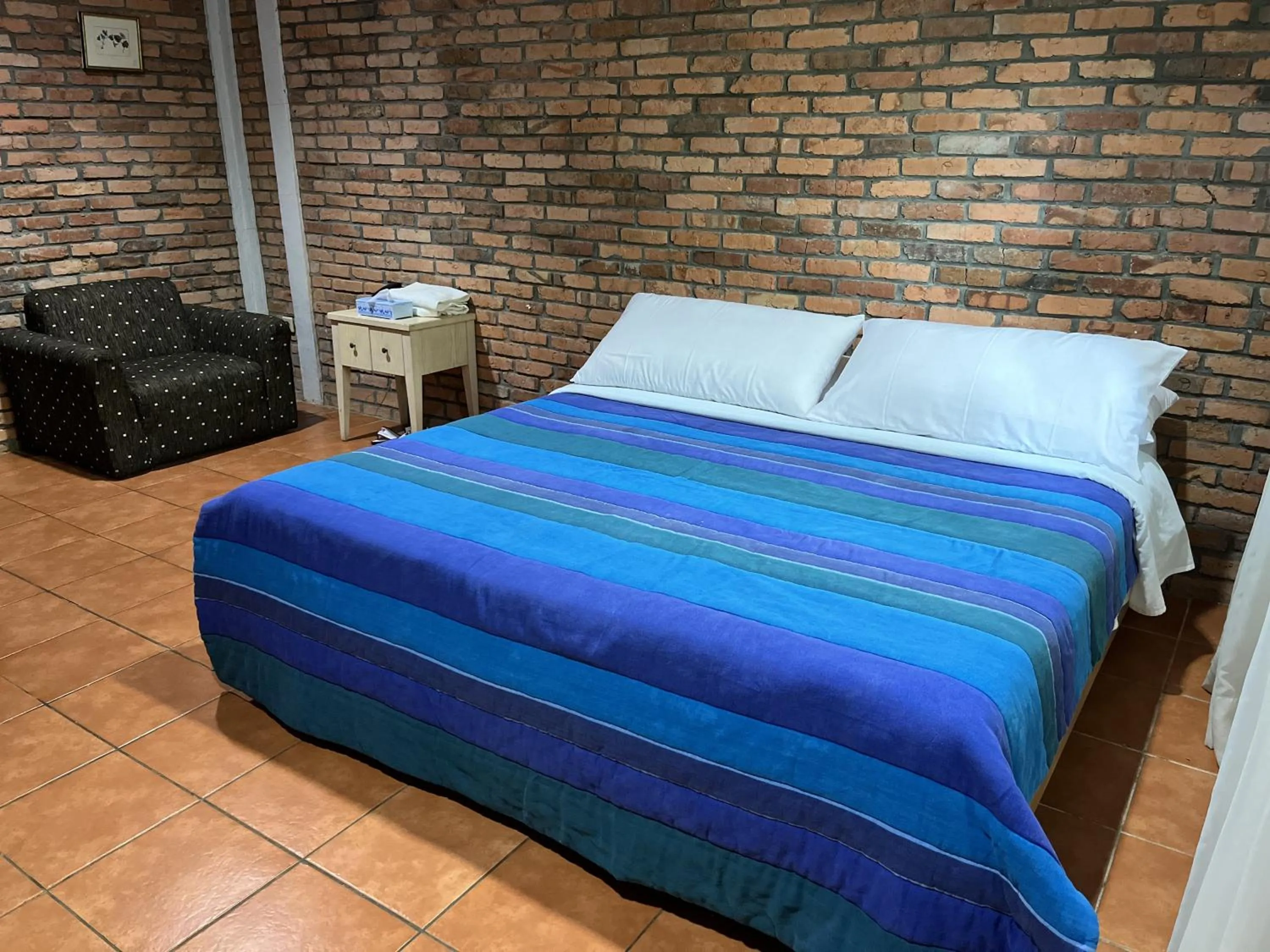 Bed in The Pinewood Lodge and Organic Farm