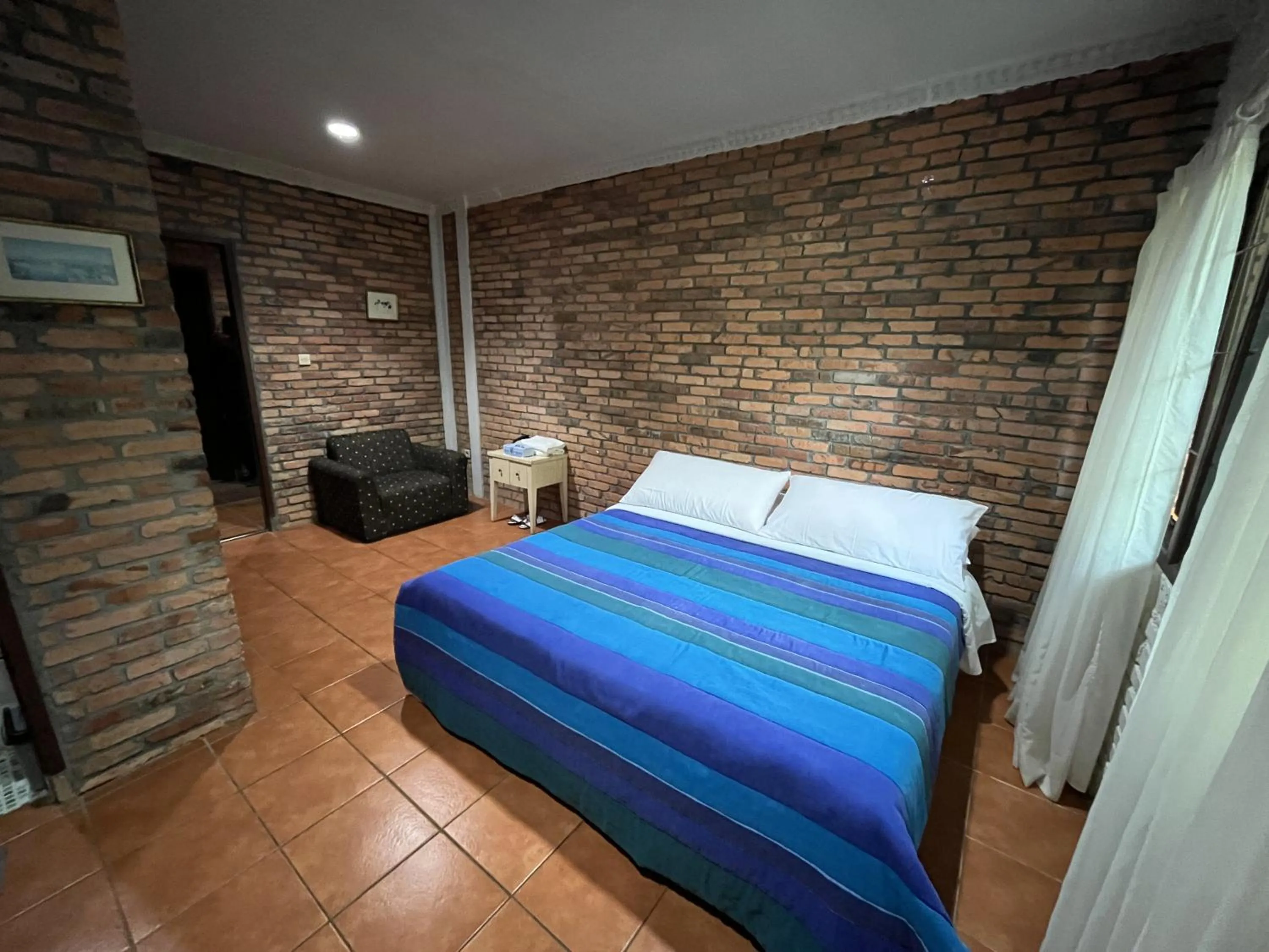 Bed in The Pinewood Lodge and Organic Farm