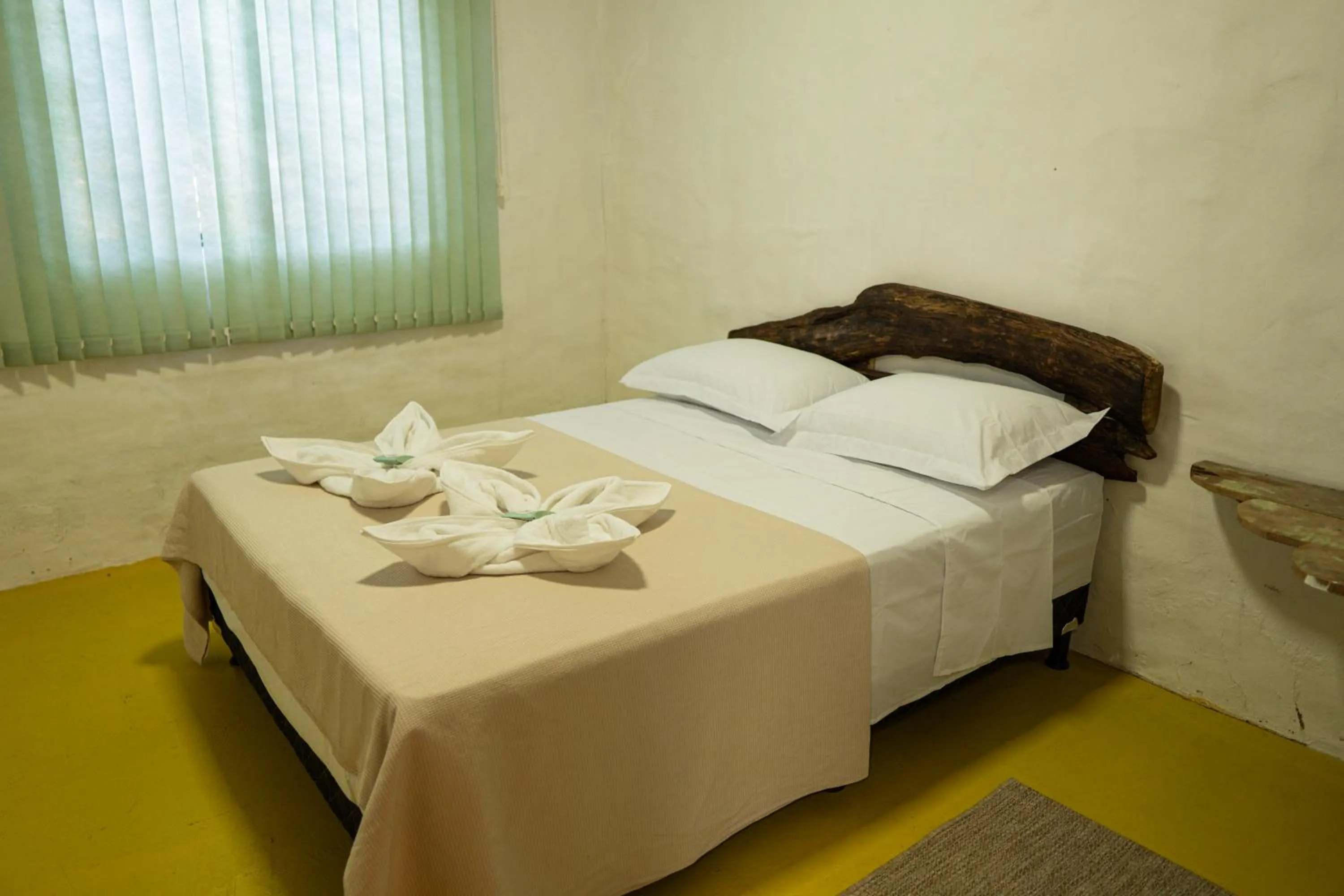 Bed in Pousada Aracuã