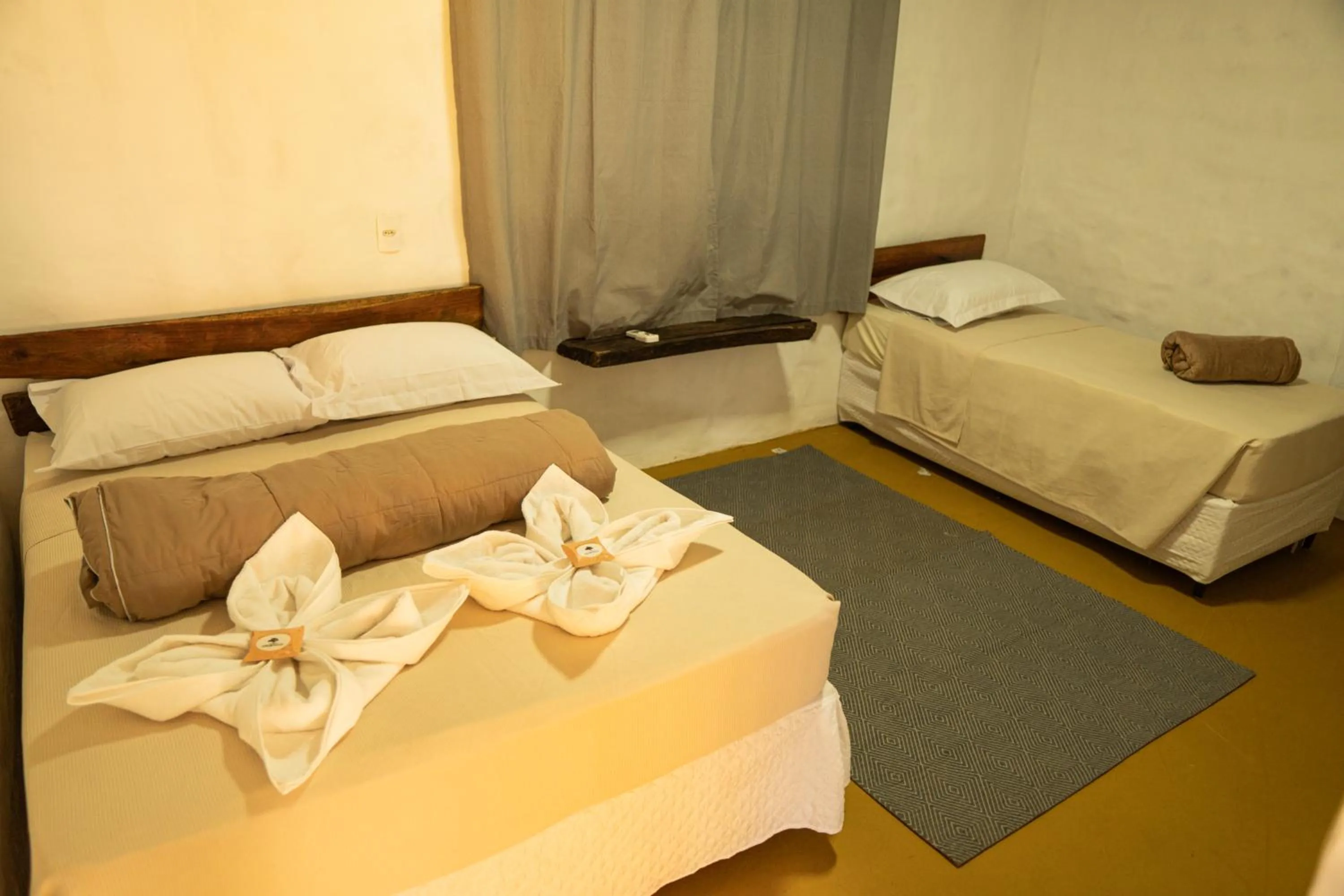 Bed in Pousada Aracuã