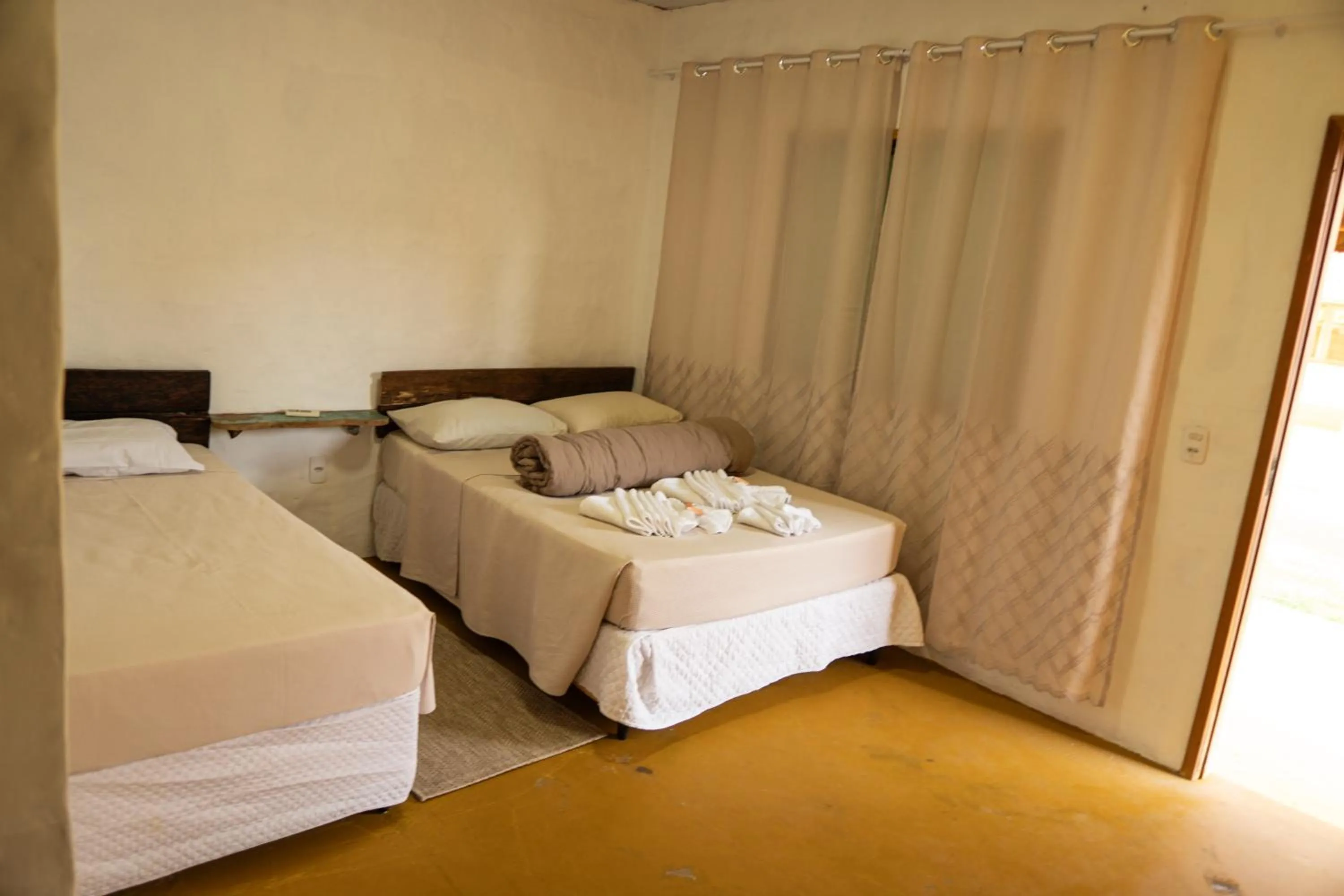 Bed in Pousada Aracuã