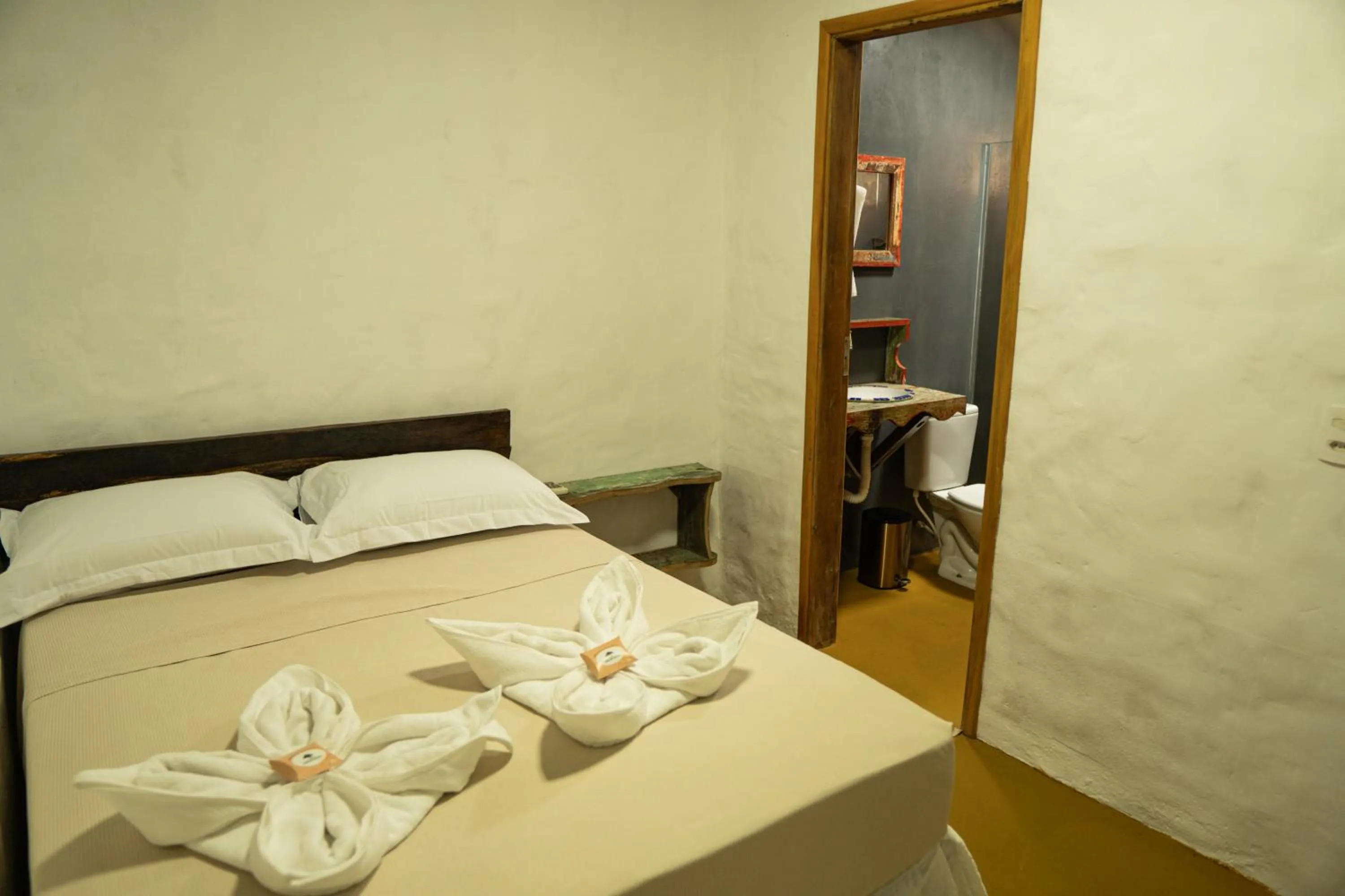 Bed in Pousada Aracuã