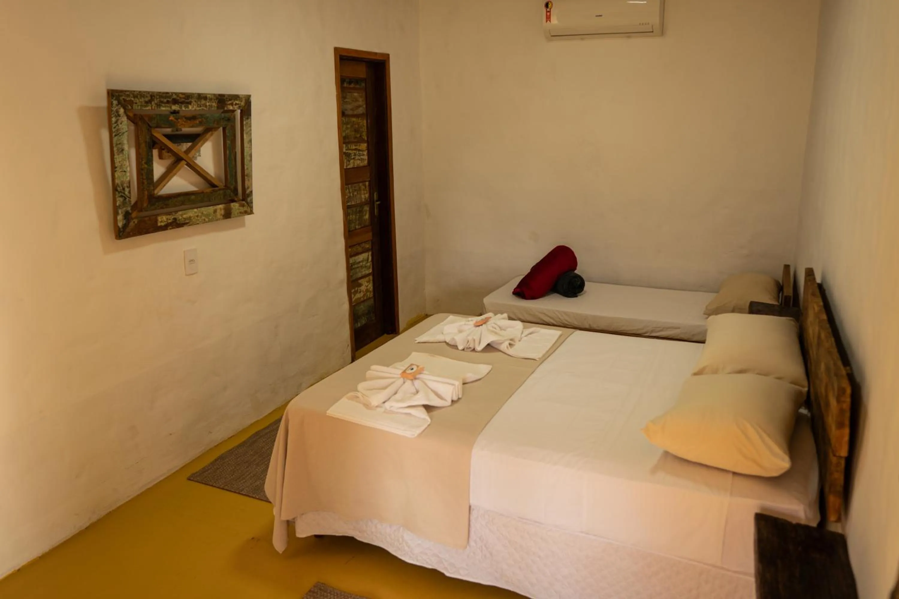 Bed in Pousada Aracuã
